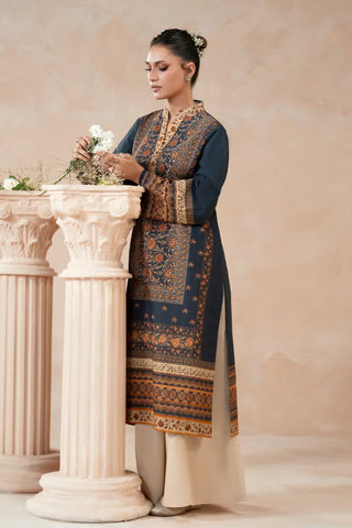 Woman wearing a traditional blue printed kurta with a beige background