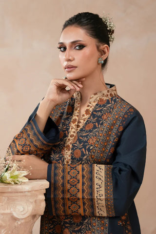 Woman wearing a traditional blue printed kurta with a beige background