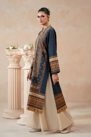 Woman wearing a traditional blue printed kurta with a beige background