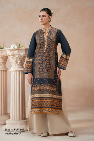 Woman wearing a traditional blue printed kurta with a beige background