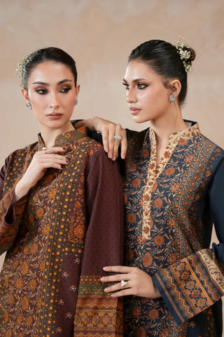 Woman wearing a traditional blue printed kurta with a beige background