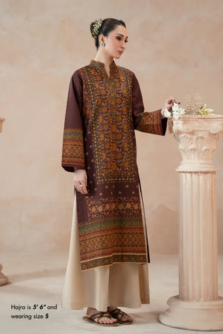 Woman wearing a traditional Plum printed kurta with a beige background